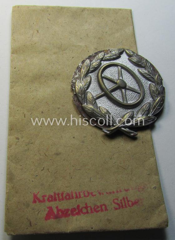 Attractive, WH (Heeres-, LW- ie. Waffen-SS-) so-called: 'Kraftfahrbewährungs-Abzeichen in Silber' being a 'virtually mint' example as was produced by the: 'Rudolf Souval'-company and that came stored in its  'Zellstoff'-based pouch