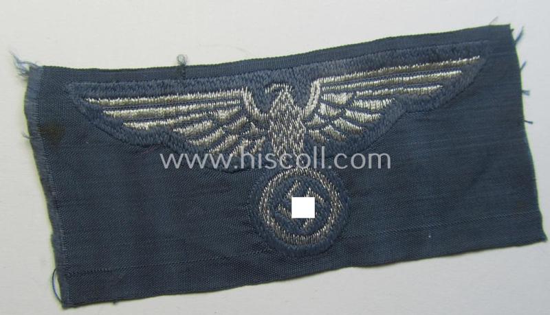 Superb, BZP (ie. 'Bahnschutz-Polizei') officers'-/ie. NCO-type side-cap- (ie. 'Schiffchen'-) eagle as woven in 'flat-wire-BeVo'-style and executed in bright-silver thread on a greyish-blue-coloured and linnen-based background