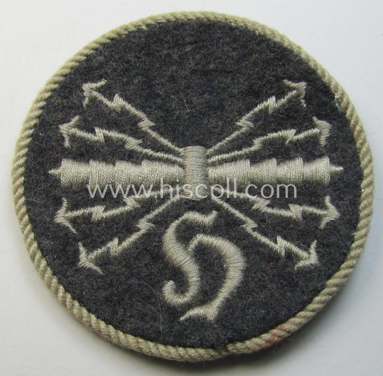 Attractive - albeit moderately used! - example of a WH (Luftwaffe) machine-embroidered, trade- ie. special-career-patch (ie. 'Tätigkeitsabzeichen') having a silver-white-toned 'Kordel' attached as was intended for: 'LW-Horchfunker'-staffmembers