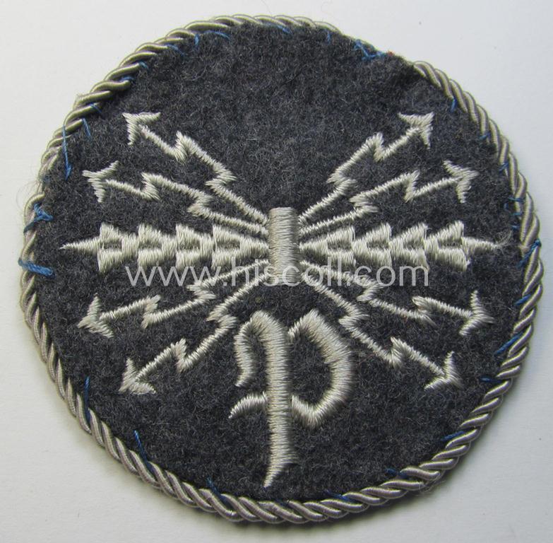 Attractive - albeit moderately used! - example of a WH (Luftwaffe) machine-embroidered, trade- ie. special-career-patch (ie. 'Tätigkeitsabzeichen') having a silver-white-toned 'Kordel' attached as was intended for: 'LW-Peilfunker'-staffmembers