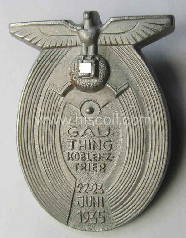 Commemorative, so-called: N.S.D.A.P.-related 'tinnie' (ie. 'Tagungs- o. Veranstaltungsabzeichen') being a maker- (ie. 'Entw. R. Kastner - Robinson'-) marked example showing the text: 'Gau.Thing - Koblenz-Trier - 22.-23. Juni 1935'