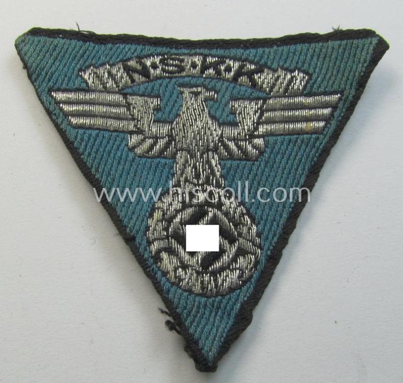 Attractive, so-called: N.S.K.K. (ie. 'National Socialistisches Kraftfahr Korps') side-cap-eagle (ie. 'Adler für N.S.K.K.-Schiffchen o. Lagermütze') being a 'flat-wire-woven'-example onto a bright-blue-coloured background