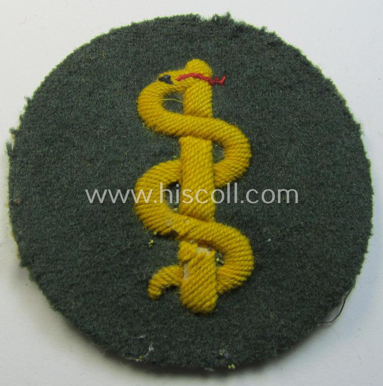 Neatly hand-embroidered - and truly used! - WH (Heeres) trade- and/or special-career insignia (ie.: 'Heeres-Tätigkeitsabzeichen') as was specifically intended for usage by: 'Sanitätspersonal' (or: medical orderlies- ie. staff)