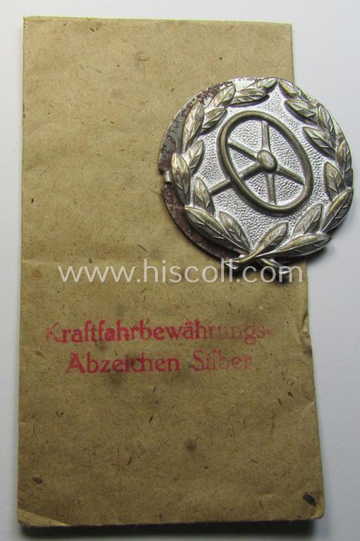 Attractive, WH (Heeres-, LW- ie. Waffen-SS-) so-called: 'Kraftfahrbewährungs-Abzeichen in Silber' being a 'virtually mint' example as was produced by the: 'Rudolf Souval'-company and that came stored in its 'Zellstoff'-based pouch