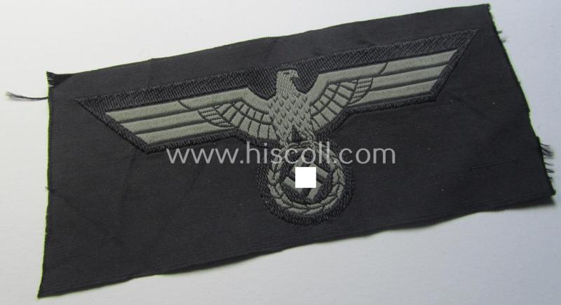 Later- (ie. mid-war-) period, WH (Heeres) 'Panzer'-type breast-eagle (ie. 'Brustadler für Panzertruppen') being a 'virtually mint- ie. unissued' example as executed in bluish-grey-coloured linnen on a black-coloured background