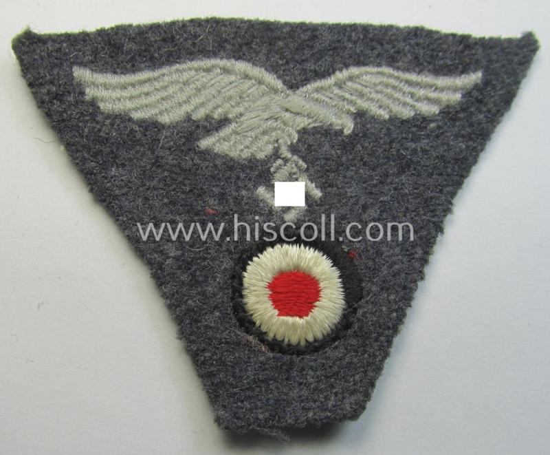 Attractive - and scarcely encountered! - WH (Luftwaffe) so-called: 'M43-pattern'-cap-trapezoid (being a machine-embroidered and 'virtually mint' example that is executed on a bluish-grey-coloured- and/or woolen-based background)