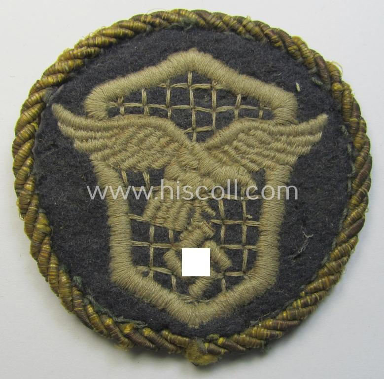 Attractive - albeit clearly used! - example of a WH (Luftwaffe) machine-embroidered, trade- ie. special-career-patch (ie. 'Tätigkeitsabzeichen') having a golden-coloured 'Goldkordel' attached as was intended for: 'LW-Kraftfahrpersonal'