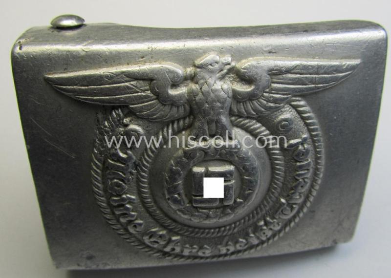 Attractive, SS- (ie. Waffen-SS), aluminium-based enlisted-mens'- (ie. NCO-type-) belt-buckle being a neatly maker- (ie. 'RzM - 36/38 SS'- or: 'Overhoff & Cie.'-) marked example that comes in a just moderately used- ie. worn, condition