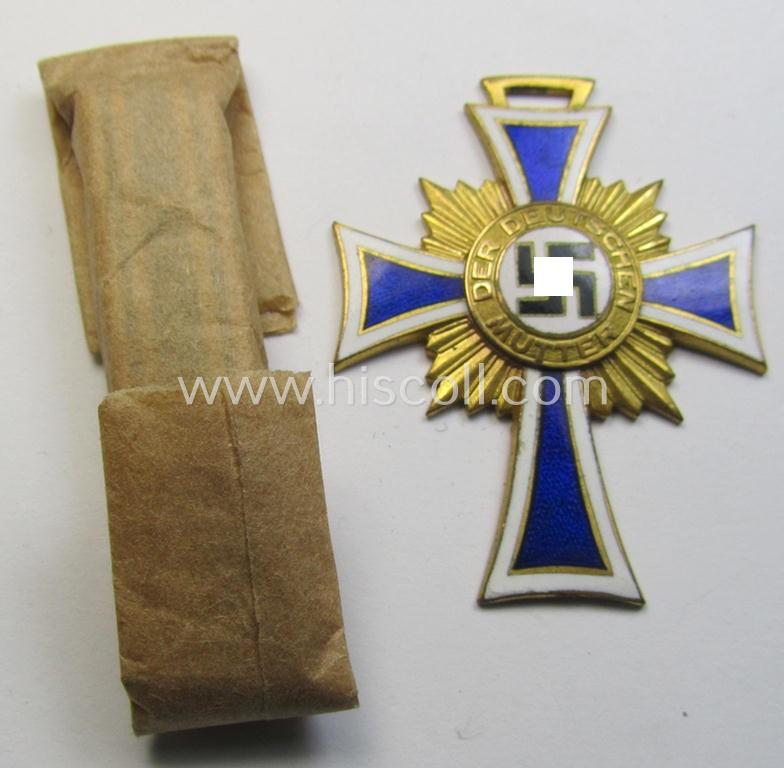 Superb, 'Ehrenkreuz der deutschen Mutter - erste Stufe' (or: golden-class mothers'-cross) being a 'virtually mint' example that comes with its accompanying, long-sized- (and also 'mint'!) ribbon as issued and/or recently found