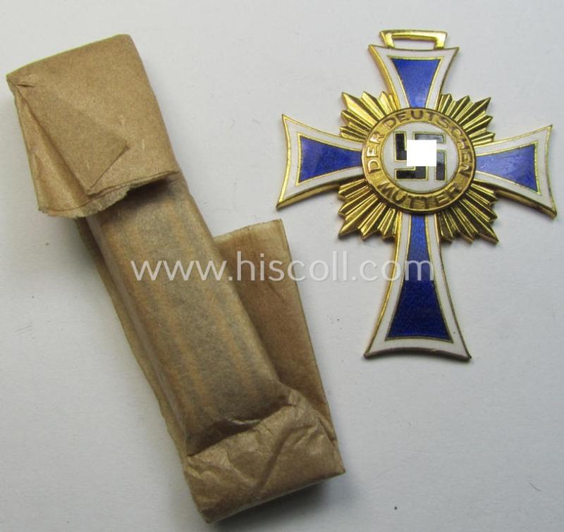 Superb, 'Ehrenkreuz der deutschen Mutter - erste Stufe' (or: golden-class mothers'-cross) being a 'virtually mint' example that comes with its accompanying, long-sized- (and also 'mint'!) ribbon as issued and/or recently found