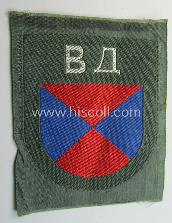 Attractive - and rarely seen! - armshield as executed in the neat 'BeVo'-weave pattern depicting the interwoven 'Cyrillic' characters: 'BA' (as was intended for the Russian volunteers serving within the 'Don Cossacks')