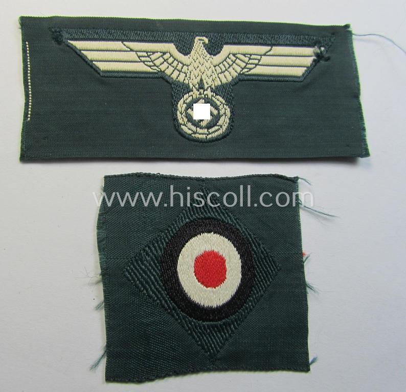 Pre- (ie. early-) war-period, WH (Heeres) cap-eagle & cocarde-set (ie. 'Schiffchenmützen-Adler u. Kokarde für Mannschaften u. Uffz.') being a 'virtually mint' set as executed in bluish-grey-coloured linnen on a darker-green-coloured background