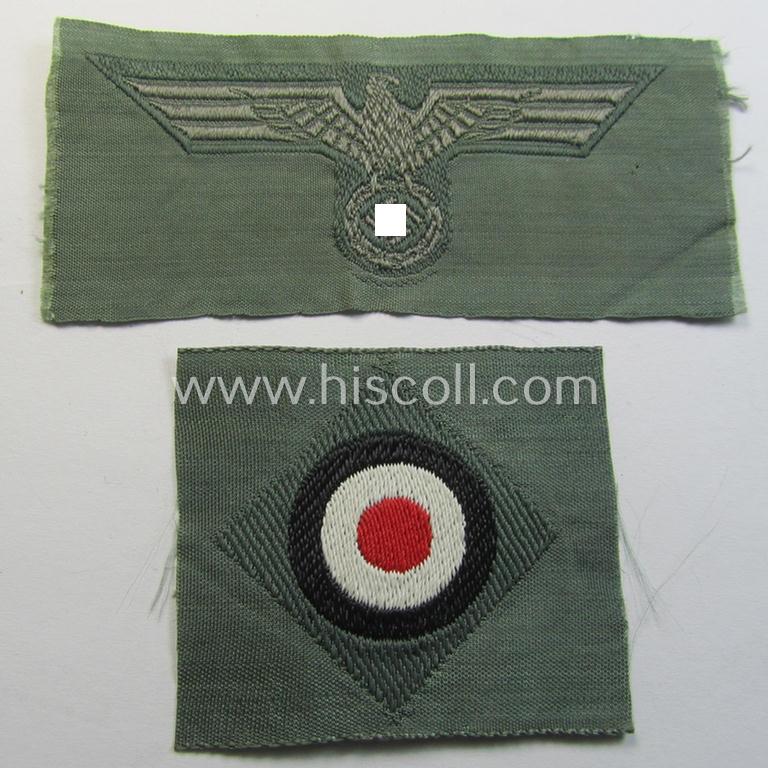 Early- (ie. mid-) war-period, WH (Heeres) cap-eagle & cocarde-set (ie. 'Schiffchenmützen-Adler u. Kokarde für Mannschaften u. Uffz.') being a 'virtually mint' set as executed in bluish-grey-coloured linnen on a field-grey-coloured background