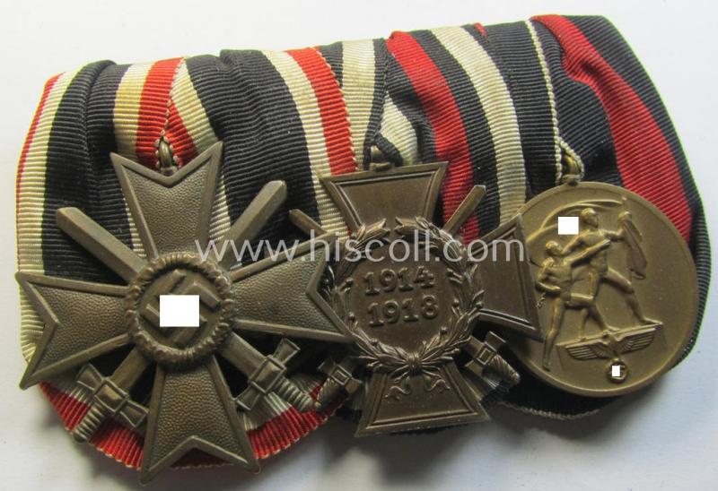 Three-pieced medal-bar (ie. 'Ordenspange') respectively depicting a: 'KvK II. Klasse m. Schw.', a: WWI-period: 'Frontkämpferkreuz 1914-18' (ie.: 'Kriegsteilnehmerkreuz mit Schwertern') and a: Czech  'Anschluss'-medal: '1 Oktober 1938'