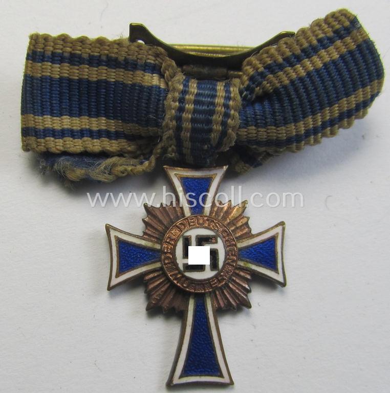 Miniature of an: 'Ehrenkreuz der deutschen Mutter - dritte Stufe' (or: bronze-class mothers'-cross) being a non-maker-marked example that comes in an overall nice- (albeit moderately worn- ie. used-), condition