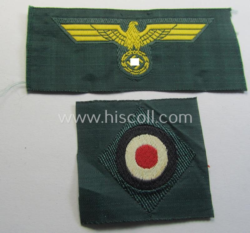 Neat, WH (KM ie. 'Küsten-Marine o. Marine-Artillerie') side-cap-eagle and cocarde-set (being a 'virtually mint- ie. unissued' set as executed in golden-yellow-coloured linnen on a darker-green-coloured background)