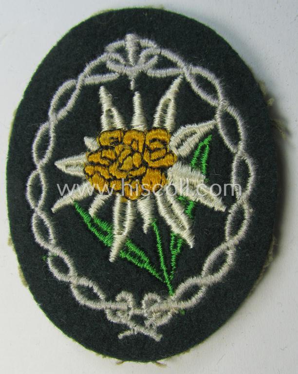 Attractive - and 'virtually mint'! - WH (Heeres) EM- (ie. NCO-) type 'Edelweiss'-armpatch being a machine-embroidered example as was executed on darker-green wool as was intended for usage by the: 'Gebirgsjäger-Truppen' throughout the war