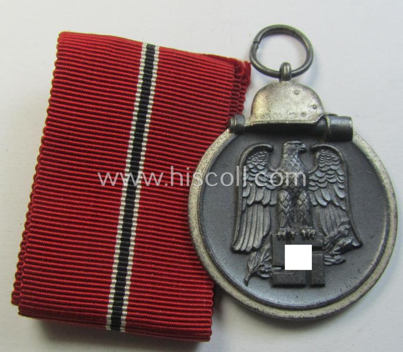 Attractive medal-set: 'Winterschlacht im Osten 1941-42' being a non-maker-marked- (and/or 'Feinzink'-based) specimen and that comes together with its (minimally confectioned) ribbon (ie. 'Bandabschnitt')