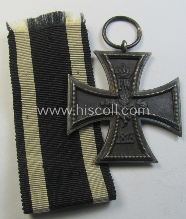 Attractive, WWI-period: 'Eisernes Kreuz II. Klasse' (or: iron cross second class) being a maker- (ie. '??'-) marked example that comes together with its (minimally) confectioned piece of ribbon (ie. 'Bandabschnitt')