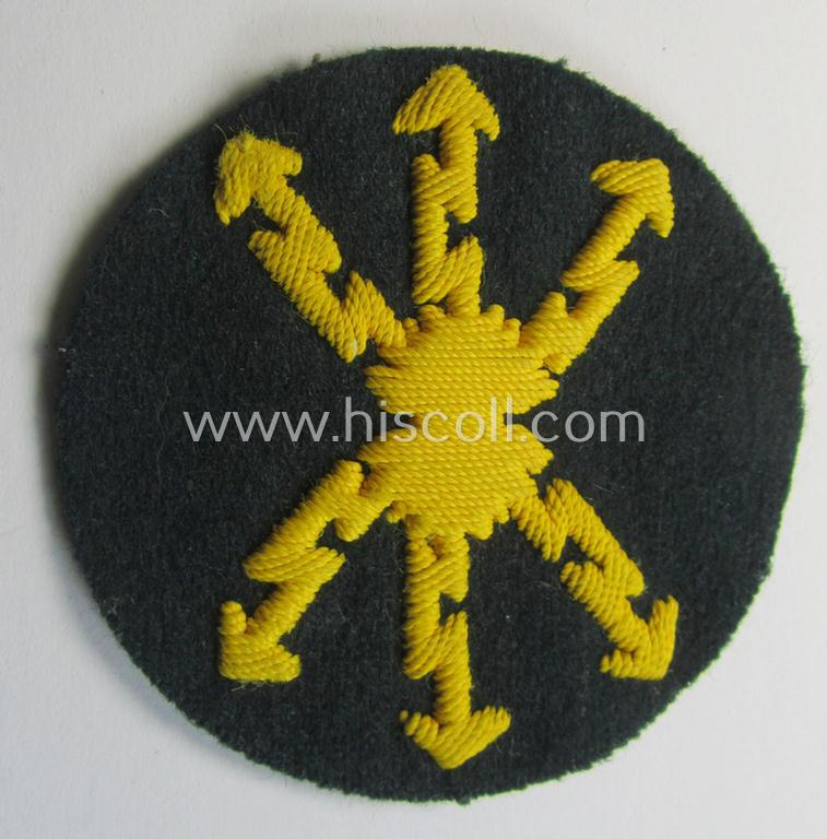 Attractive, WH (Heeres) so-called: trade- and/or special career arm-insignia as was intended for a: 'Funkmeister' being a neatly hand-embroidered (and maker-marked) specimen on a darker-green-coloured woolen-based background