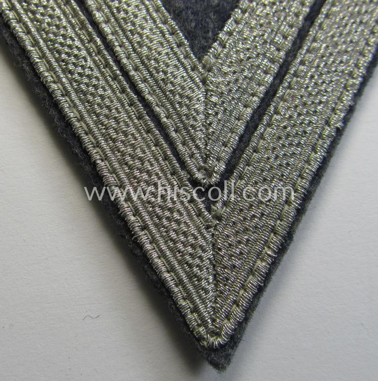 Attractive, WH (Luftwaffe) 'Armwinkel' (or: arm-chevron) as executed on typical bluish-grey-coloured wool as was specifically intended for usage by a soldier with the (unusually encountered!) rank of: 'Stabsgefreiter'