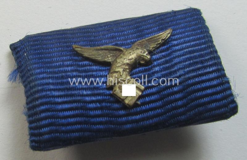 Single-pieced, WH (Luftwaffe) related ribbon-bar (ie. 'Feld-/Bandspange') showing the ribbon for a: 'WH (LW) Dienst-Auszeichnung der 4. Stufe' (and having a neat 'down-tailed' eagle-device attached)