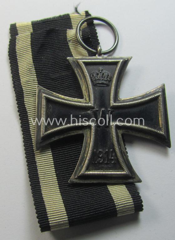 Attractive, WWI-period: 'Eisernes Kreuz II. Klasse' (or: iron cross second class) being a clearly maker- (ie. 'KO'-) marked example that comes together with its (minimally) confectioned piece of ribbon (ie. 'Bandabschnitt')