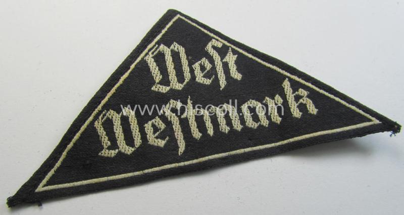 Neat, HJ/BDM ('Hitlerjugend' ie.: 'Bund Deutscher Mädel') district-triangle (ie. 'Gebietsdreieck') entitled: 'West Westmark' (being a 'virtually mint- ie. unissued' example that still retains its period-attached 'RzM'-etiket)