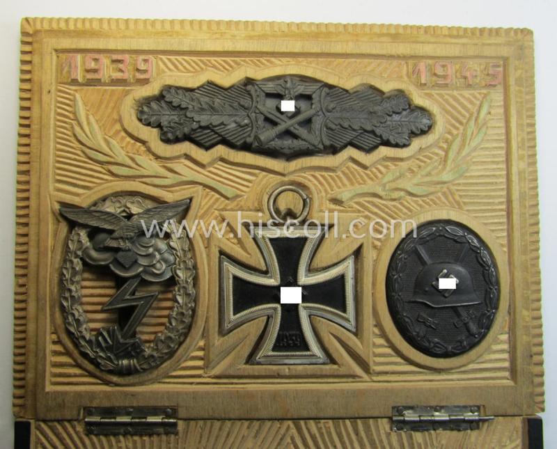 Unique, period-hand-carved 'award-box' holding resp. a (superb!): 'Nahkampfspange in Bronze', an: 'EK II.Kl.', a: 'Verwundeten-Abz. in Schwarz' and a (regrettably denazified!) 'Erdkampfabz. der Luftwaffe'