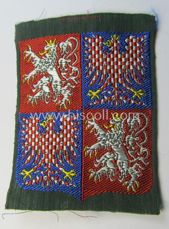 Attractive - and truly scarcely seen! - colourful and neatly 'BeVo'-woven armshield as was specifically intended for a volunteer who served within the: 'Luftschutzpolizei Böhmen-Mähren' (as situated in the: 'Protektorat Böhmen-Mähren')