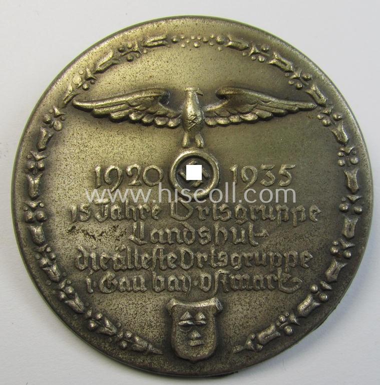 Commemorative, silverish-toned-, 'N.S.D.A.P.'-related 'tinnie' depicting an N.S.D.A.P.-party-eagle and surrounded by the text: '15 Jahre Ortsgruppe Landshut - die älteste Ortsgruppe i. Gau bay. Ostmark - 1920 -1935'