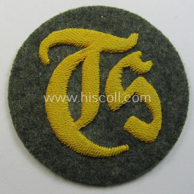 Superb - and truly rarely encountered! - WH (Heeres) hand-embroidered, trade- and/or special-career insignia (ie. 'Tätigkeitsabzeichen') as executed on a field-grey-coloured background as was specifically intended for a: 'Truppensattlermeister'