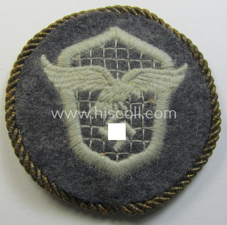 Attractive - albeit minimally used! - example of a WH (Luftwaffe) machine-embroidered, trade- ie. special-career-patch (ie. 'Tätigkeitsabzeichen') having a golden-coloured 'Goldkordel' attached as was intended for: 'LW-Kraftfahrpersonal'