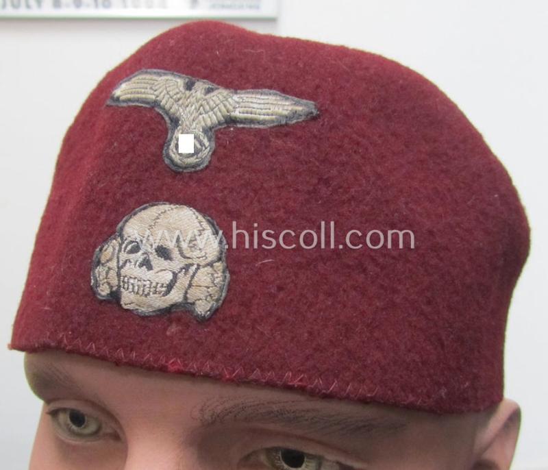 Attractive - and nowadays scarcely found! - maroon-red-coloured, Waffen-SS-pattern so-called: 'Fez' having a neat - and fully matching! - silver-grey-coloured- and/or 'BeVo'-woven insignia-set originally- (ie. 'off-factory'-) attached