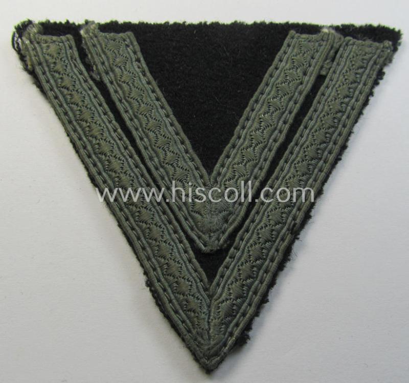 Moderately used, Waffen-SS- (ie. Heeres Panzer-) type 'Armwinkel' (or: rank-chevron) as executed on black-coloured wool as was intended for an: 'SS-Rottenführer' (ie. 'Obergefreiter')