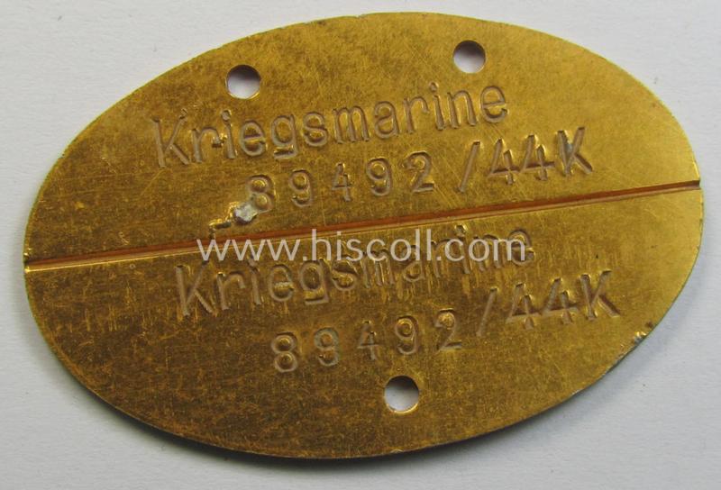 Later-war- (albeit 'standard-issue'-) pattern, WH (Kriegsmarine) typical aluminium-based- and/or bright golden-bronze toned ID-disc (ie. 'Erkennungsmarke') bearing the engraved coded numeral (ie. text) that simply reads: 'Kriegsmarine 89492/44K'