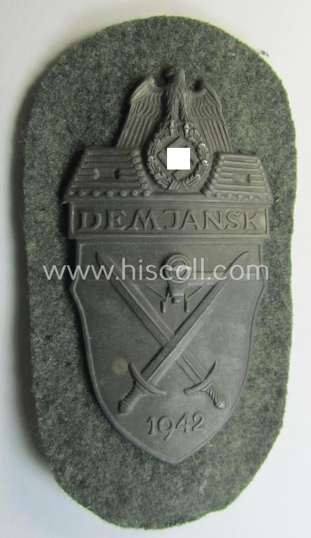 Superb example of a - fairly scarcely encountered! - WH (Heeres ie. Waffen-SS) 'Demjansk'-campaign-shield as executed in typical non-magnetic, so-called: 'Feinzink' (and that comes in an overall very nice- ie. fully untouched condition)