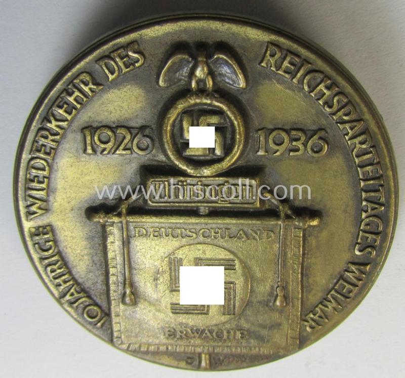 Very detailed, golden-bronze-toned N.S.D.A.P.-related day-badge (ie. 'tinnie' or: 'Veranstaltungsabzeichen') as was issued to commemorate a party-related meeting: '10 Jahrige Wiederkerhr des Reichsparteitages Weimar - 1926-1936'