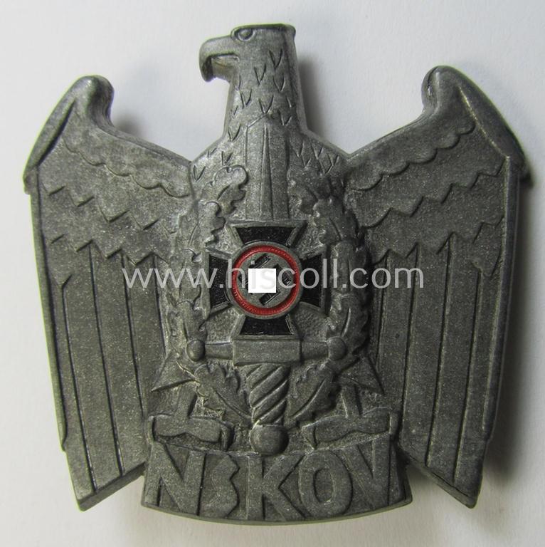 Attractive - and actually scarcely encountered! - metal-based cap-badge (ie. 'Mützenabzeichen') being a maker- (ie. 'RzM M1/52'-) marked example as was intended for usage by the: 'Nationalsozialistischer Kriegsopfer-Versorgung' (ie.: 'N.S.K.O.V.')