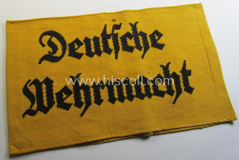 Linnen-based- and/or neatly 'BeVo'-woven, golden-yellow-coloured armband (ie. 'Armbinde') entitled: 'Deutsche Wehrmacht' as was intended for (civilian) staff-members serving within the German armed forces ie. 'Deutsche Wehrmacht'