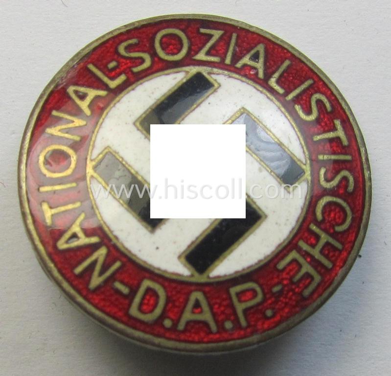 Neat - bright-red-coloured and nicely preserved! - 'N.S.D.A.P.'-membership-pin- ie. party-badge (or: 'Parteiabzeichen') which is maker-marked on its back with the makers'-designation: 'RzM' and/or: 'M1/52'