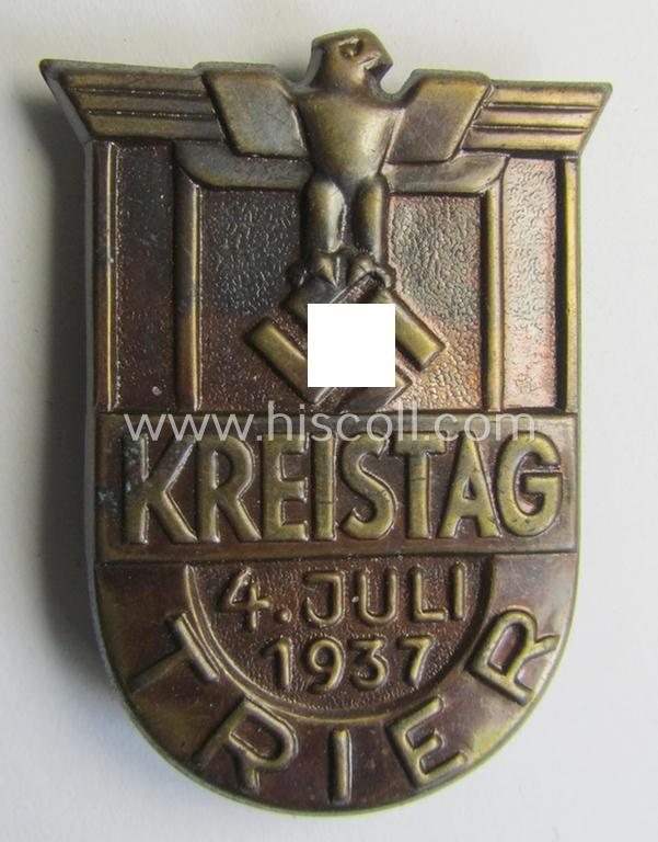 Attractive, darkened bronze-toned- (and I deem typical 'Eisenblech'-based) so-called: N.S.D.A.P.-related day-badge (ie. 'tinnie' or: 'Veranstaltungsabzeichen') as was issued to commemorate the: 'N.S.D.A.P.-Kreistag - Trier - 4. Juli 1937'