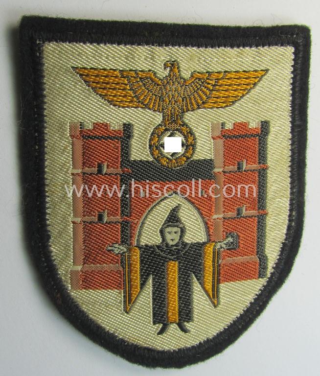 Superb - and never before encountered! - multi-coloured N.S.D.A.P.-related arm-shield (or armband-device) showing the coat of arms of the town of München (ie. 'Hauptstadt der Bewegung')