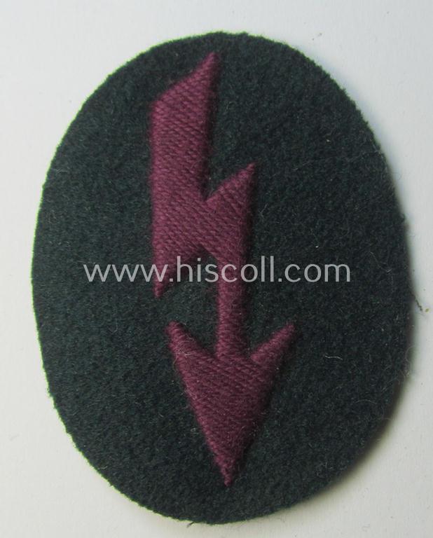 Neat, WH (Heeres) trade- and/or special-career-insignia (ie. hand-embroidered 'signal-blitz') being a clearly maker-marked example as executed in bordeaux-coloured linnen as was specifically intended for a soldier within the: '(Nebel)Werfer-Truppen'