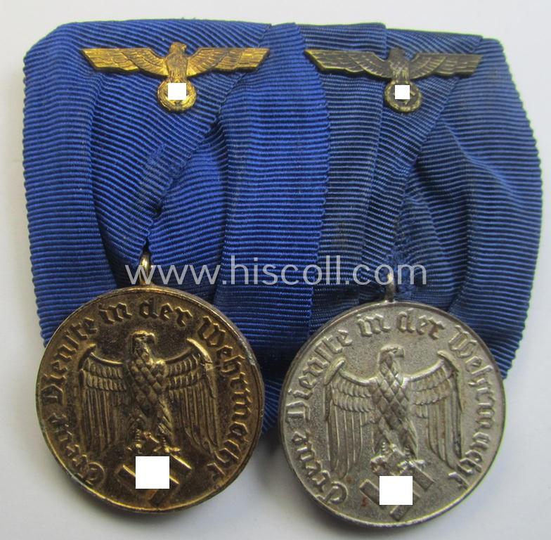 Attractive - and truly used! - two-pieced medal-bar (ie. 'Spange') showing two: WH (Heeres o. Kriegsmarine) so-called: 'Dienstauszeichnungen für 4 u. 12 Jahre Treue Dienste' that both come period-mounted as a so-called: 'Doppelspange'