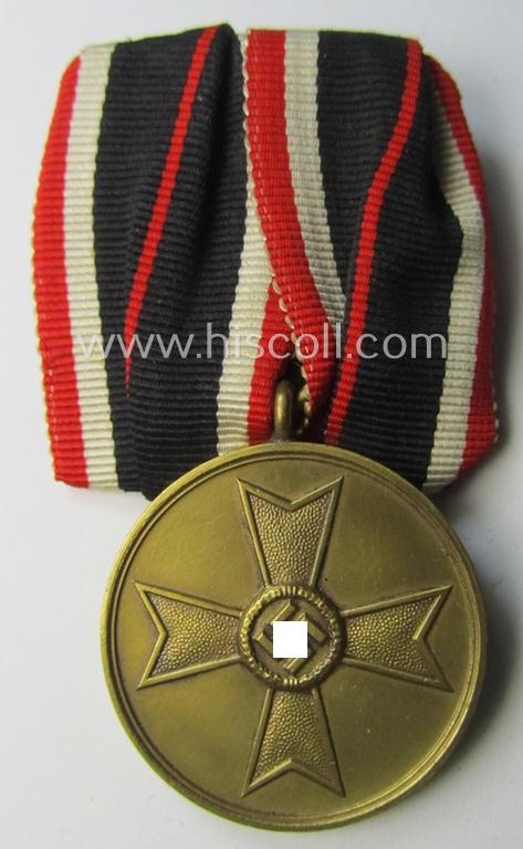 Attractive example of a so-called: 'Einzelspange' (ie. single-pieced medal-bar) showing a: 'Kriegsverdienstmedaille 1939' (or: war-merits-medal), being a neat 'Buntmetall'-based specimen