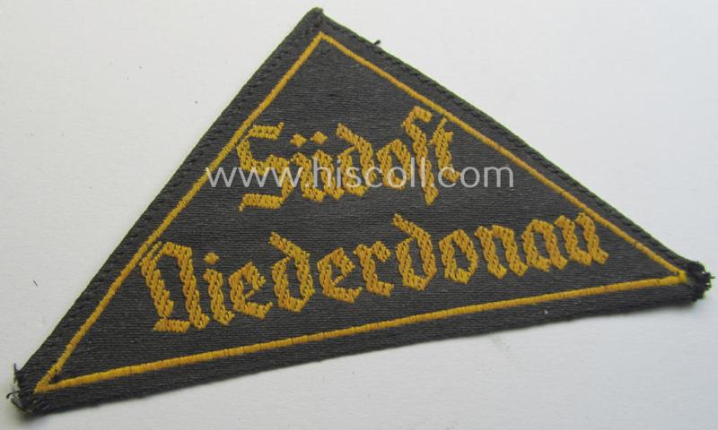 Attractive - and scarcely encountered! - 'HJ' ('Hitlerjugend') district-triangle (ie. 'Gebietsdreieck') entitled: 'Südost Niederdonau' being a moderately used- ie. worn example that retains its period-attached 'RzM'-etiket