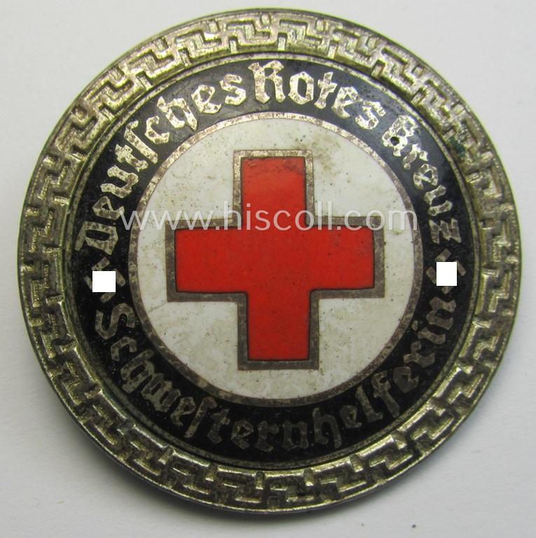 Attractive - and nicely preserved! - DRK (ie. 'Deutsches Rotes Kreuz' or German Red Cross) nurses'-helpers-badge entitled: 'Schwesternhelferin' (being an example that shows a: 'Ges.Gesch.'-patent-pending (and '1'-) marking on its back