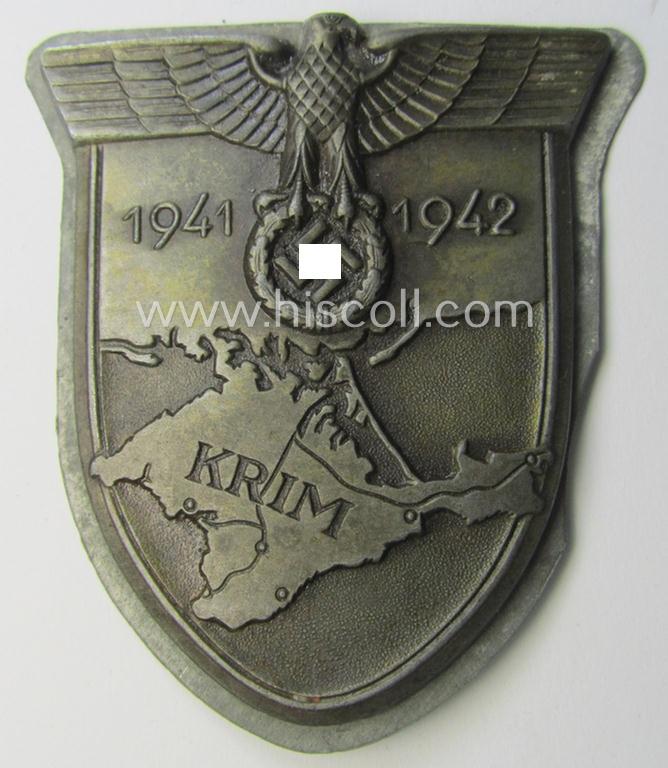 Attractive - and nicely preserved! - WH (Heeres ie. Waffen-SS etc.) 'Krim'-campaign-shield (as was produced by a by me unidentified maker) and that comes in a presumably issued - albeit never mounted- ie. 'virtually mint', condition