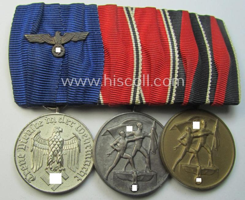 Superb, 3-pieced WWII-period medal-bar (ie. 'Ordenspange') of the desirable 'detachable'-pattern showing resp. a: 'WH-Dienstauszeichnung der 4. Stufe' and two (Austrian and/or Czech) 'Anschluss'-medals
